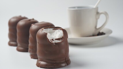 White Chocolate Krembo on the table. A chocolate-coated marshmallow treat that is popular in Israel.