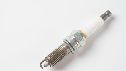 The old spark plug on white background . Car and motorcycle part