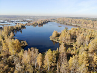 Lake among swamps, near the city, autumn, Russia.