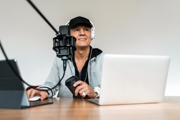 The man's favorite job is putting on music. The blogger works in a radio studio. The radio host...