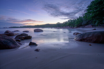 sunset at tropical beach at anse lazio on praslin, seychelles