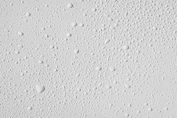Small drops of water on a white background