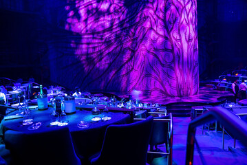 Cancun, Mexico. May 30, 2021. Table setting with wine glasses and bottle at restaurant for Cirque du soleil in Cancun - obrazy, fototapety, plakaty