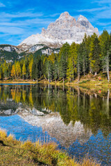 Autumn colors on the lake of Antorno. Magical glimpses of the Dolomites. Three peaks of Lavaredo