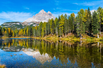 Autumn colors on the lake of Antorno. Magical glimpses of the Dolomites. Three peaks of Lavaredo