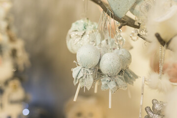 Close up of Christmas decorations with delicate blue toys on the branch