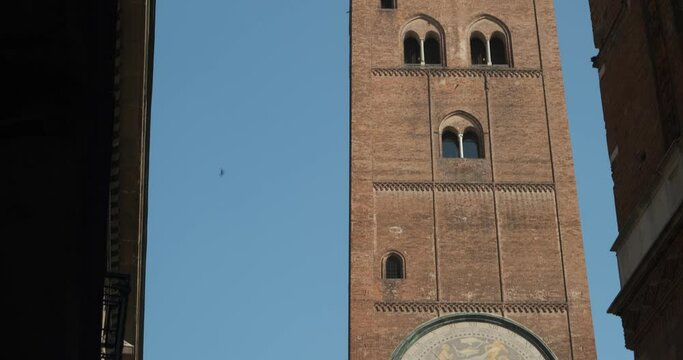 Tower of Cremona. Tower symbol of Cremona.The Torrazzo with the large astronomical clock or astrolabe whose name inspired the famous sweet Torrone. 
