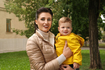 Portrait of happy mother with her son in park