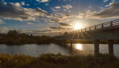 A long bridge at sunset.