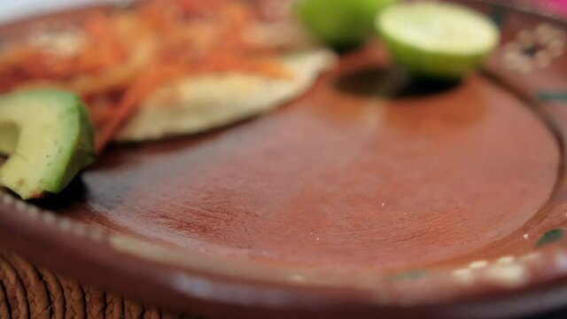Vegan Mexican tinga taco on traditional clay plate