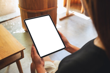 Mockup image of a woman holding digital tablet with blank white desktop screen