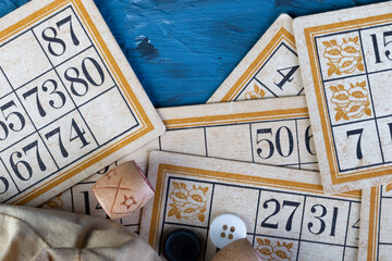 Family Lotto board game. Cards and barrels with numbers. Play at home on a cold winter day or in a new pandemic environment. Bingo game. Gambling . flat lay