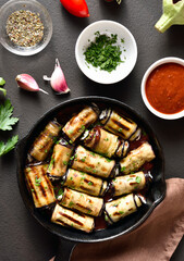 Eggplant (aubergine) rolls with cheese and greens