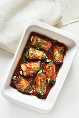 Baked eggplant rolls with tomato sauce and cheese