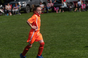 Young girl on Soccer Field running. Granddaughter in youth sports in Kirkwood in Upstate NY in...