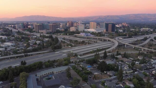 Aerial Hyperlapse Of The San Jose city skyline and freeway at sunset