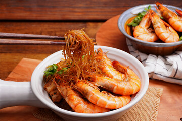 Prawns and pork belly, baked vermicelli with coriander, spring onions and chives, Asian food, in a cup with handle