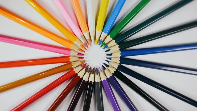 The felt pen spin rotate quickly fast fly, dispart, splash to the sides with centrifugal coriolis force. The video is in reverse. The marker twist, create pattern, make design shape picture.
