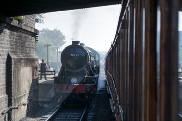 Sheringham, Norfolk, UK - SEPTEMBER 14 2019: WD 2-10-0 – 90775 ‘The Royal Norfolk Regiment’ 1943 steam train at the platform during 1940s weekend