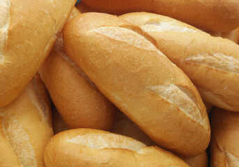 Many fresh wheat bread buns as background