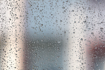 Drops on glass from rain as an abstract background.