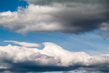 Cumulus clouds in the blue sky. No land view.