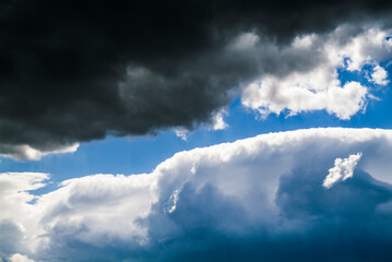 Cumulus clouds in the blue sky. No land view.