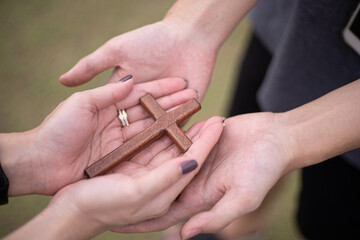 Hand with cross .Concept of hope, faith, christianity, religion, church online.