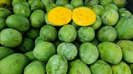 pile of mangoes in the market