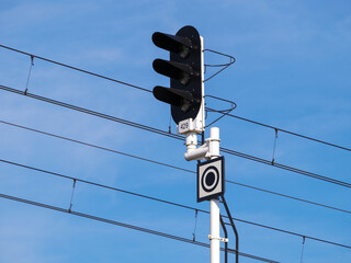 Railroad signals pole, railway signal lights for trains and suspended overhead electric power train...