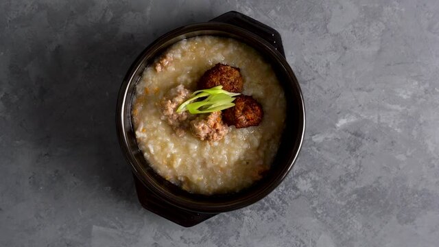 delicious boiled ground pork and deep fried pork on congee