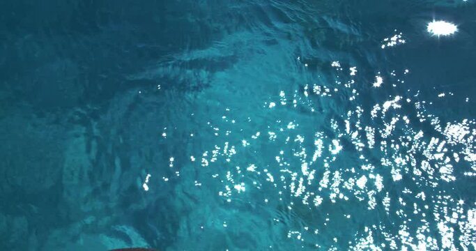 Top view of crystal clear sea water white said bottom