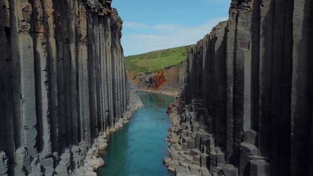 Studlagil canyon in iceland. Basalt columns. Aerial drone video of Icelandic landscape. Famous tourist attractions and landmarks destinations in Icelandic nature on Iceland. 4K UHD video.