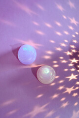 two pink menstrual cups on a background with stars photo top view