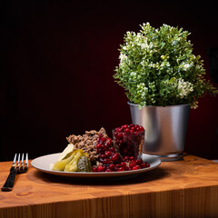 Traditional Finnish cuisines; closeup of sautéed reindeer on a plate with lingonberry jam and...