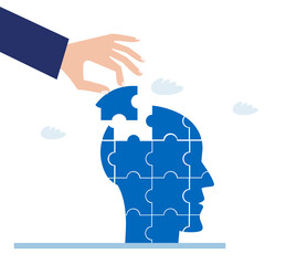 Hand of businessman places puzzle piece in human's head. 