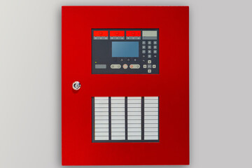Fire panel with buttons and sensors. Red panel for fire safety control. Fire panel on a light...