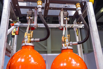 Industrial automatic fire extinguishing system. Balloons of an automatic fire extinguishing system. Cabinet with balloon of fire-fighting foam. Industrial flame extinguishing system close up - obrazy, fototapety, plakaty