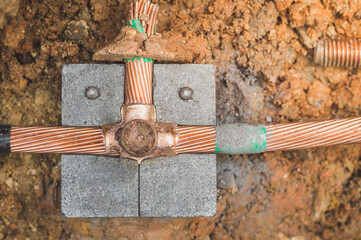 Welding copper ground wire on ground rod.Welding copper ground wire.Connect copper grounding...