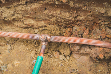 Welding copper ground wire on ground rod.Welding copper ground wire.Connect copper grounding lightning protection system. With the melting