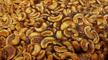 Cashew nuts caramel as topping of   homemade toffee cake or coffee and chocolate cake. 