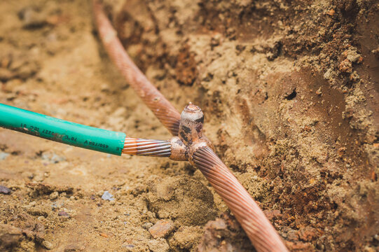 Welding copper ground wire on ground rod.Welding copper ground wire.Connect copper grounding lightning protection system. With the melting