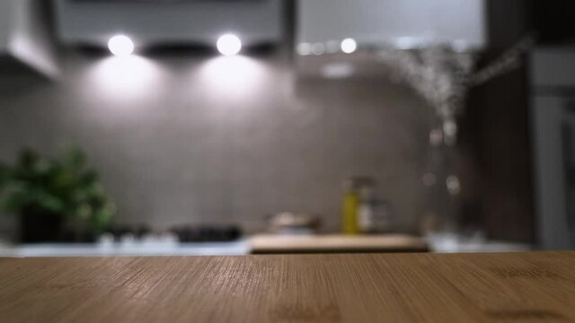Wooden table top on blur kitchen room background. For displaying the assembly product or visual arrangement of the configuration keys