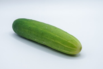 Green cucumber on a white background.