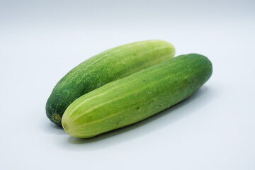 Green cucumber on a white background.