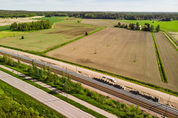 Aerial panoramic view of pathway, road and railway in place Myllykoski in Kouvola, Finland.