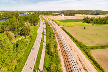 Fototapeta na wymiar Aerial panoramic view of pathway, road and railway in place Myllykoski in Kouvola, Finland.