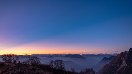 Naklejka premium Winter sunset from an alpine peak of Friuli-Venezia Giulia