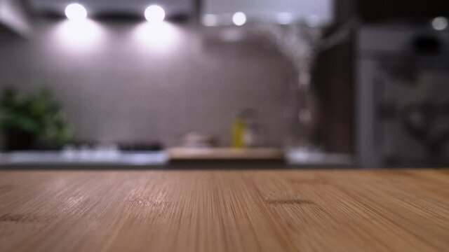 Wooden table top on blur kitchen room background. For displaying the assembly product or visual arrangement of the configuration keys