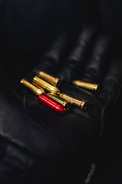 bullets on black glove